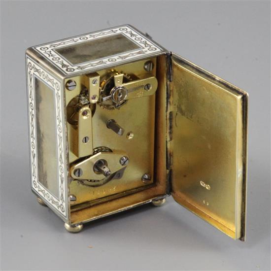 An early 20th century continental silver and enamel miniature carriage timepiece, with leather carrying case, 2in.